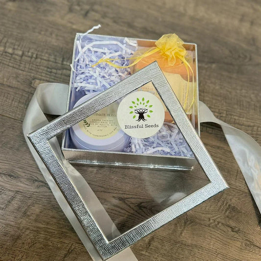 Affordable gifts presented with thoughtful, luxurious styling, including an astrology-inspired necklace, a glass candle, a DIY kit, and personalized details that make the gifts feel premium and intentional
