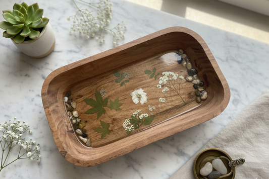 Wooden Bowl with White Floral Design and River Rocks