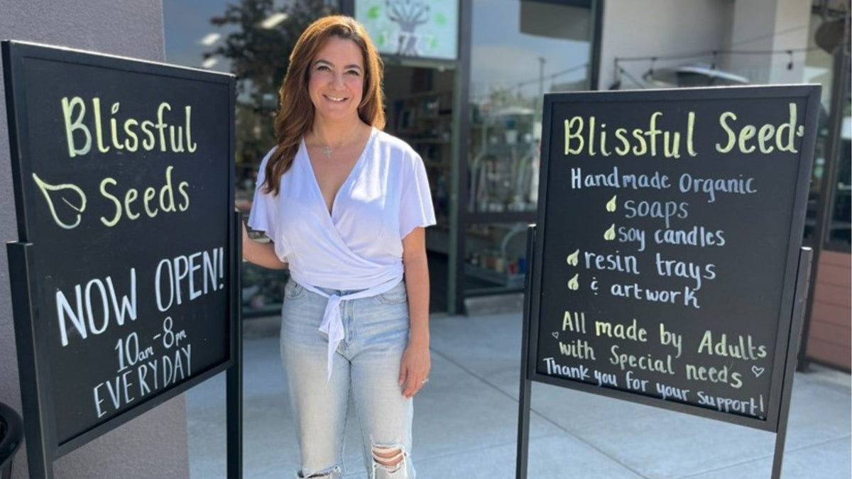 Now Open chalkboard signs outside the Blissful Seeds gift shop in Poway, California