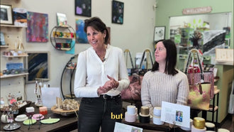 A woman and a young artist standing among handmade gifts inside the Blissful Seeds shop