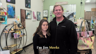 Jessica standing with Jim Meeks in the Blissful Seeds shop, with artwork and handbags behind them