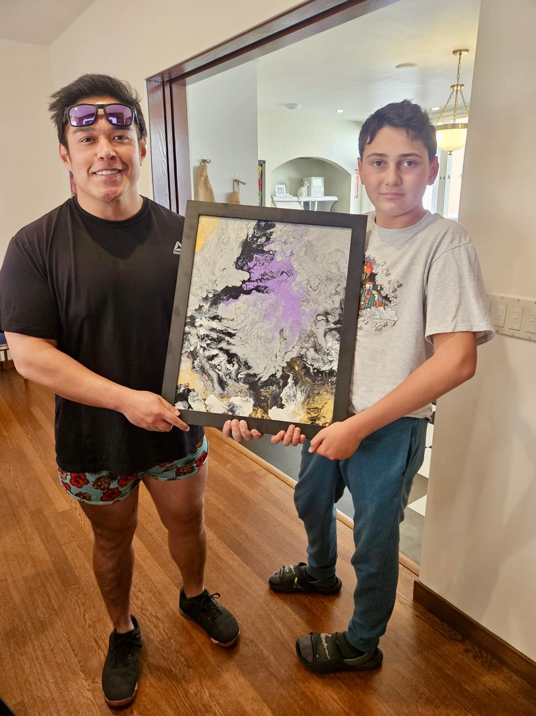 Blissful Seeds artist Michael presenting one of his custom paintings